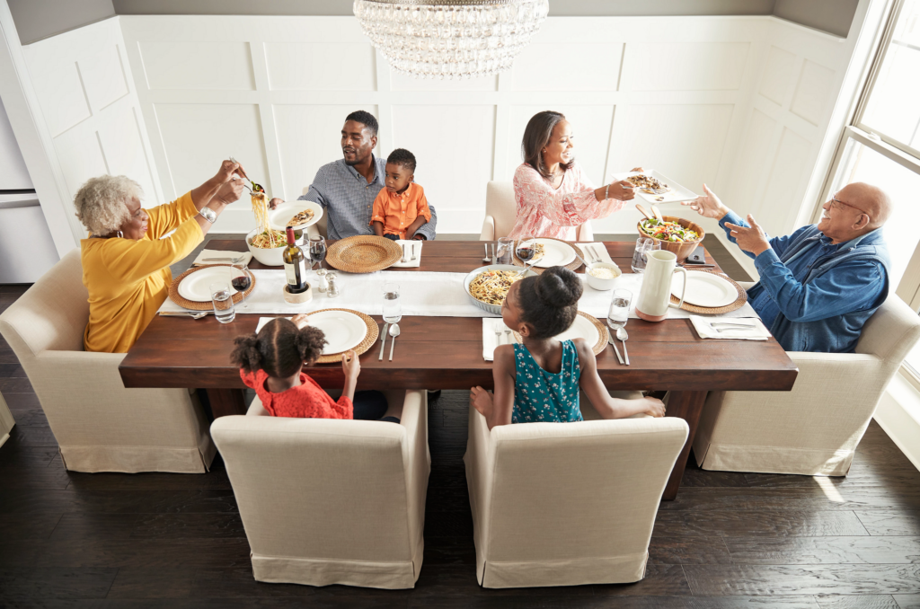 Happy family enjoying breakfast | Roberts Carpet