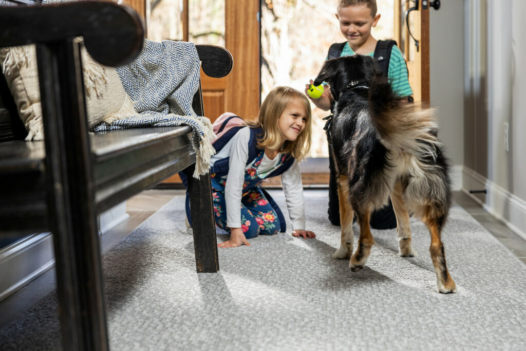 Kids on carpet floor with pet friendly | Roberts Carpet