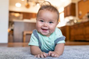 Cute baby laying on carpet floor | Roberts Carpet